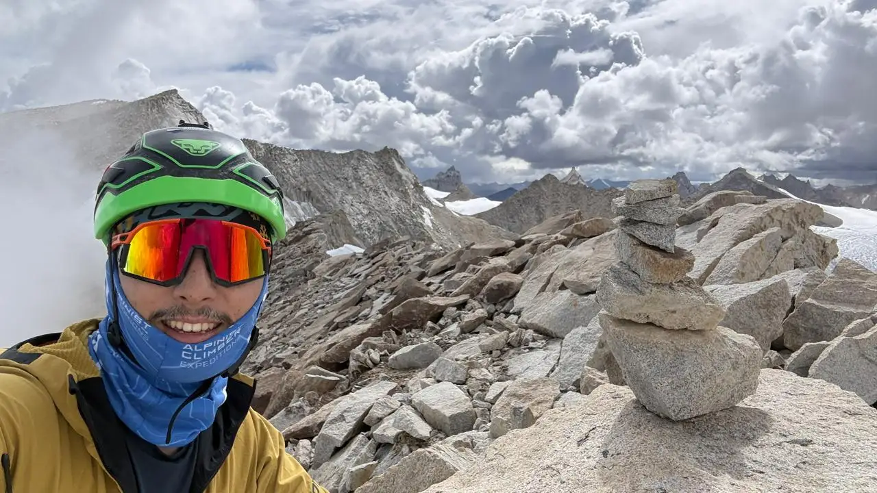 Alpine Climber on the summit ridge of Chhuama IV